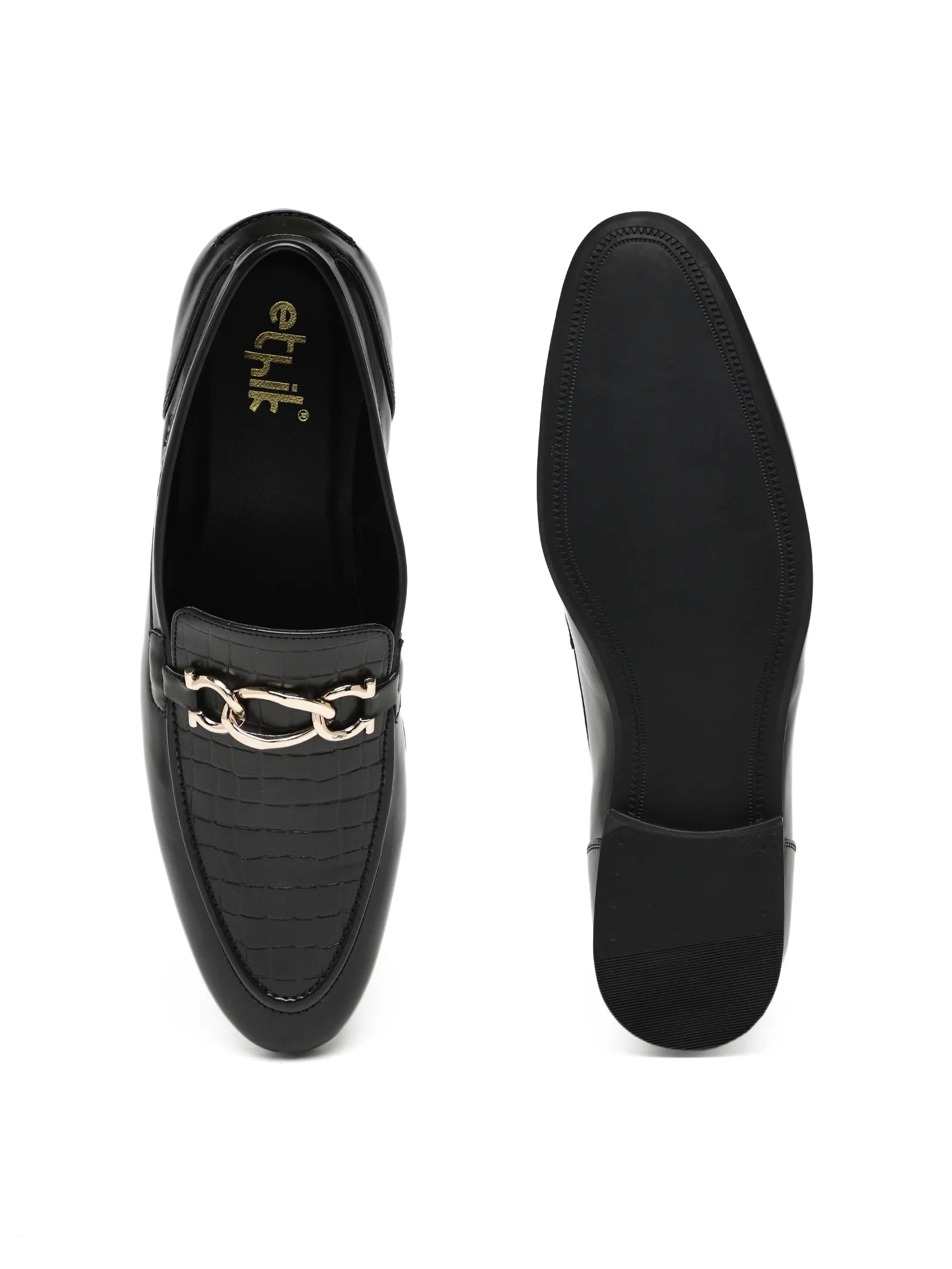 Black loafers with gold accents on a white background