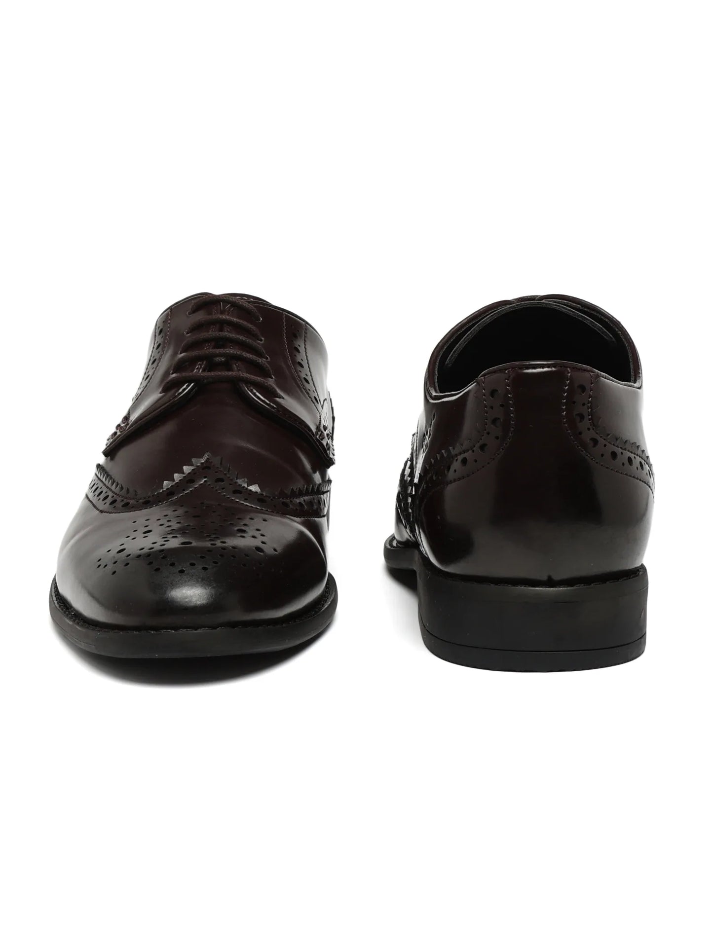 Pair of black dress shoes on a white background