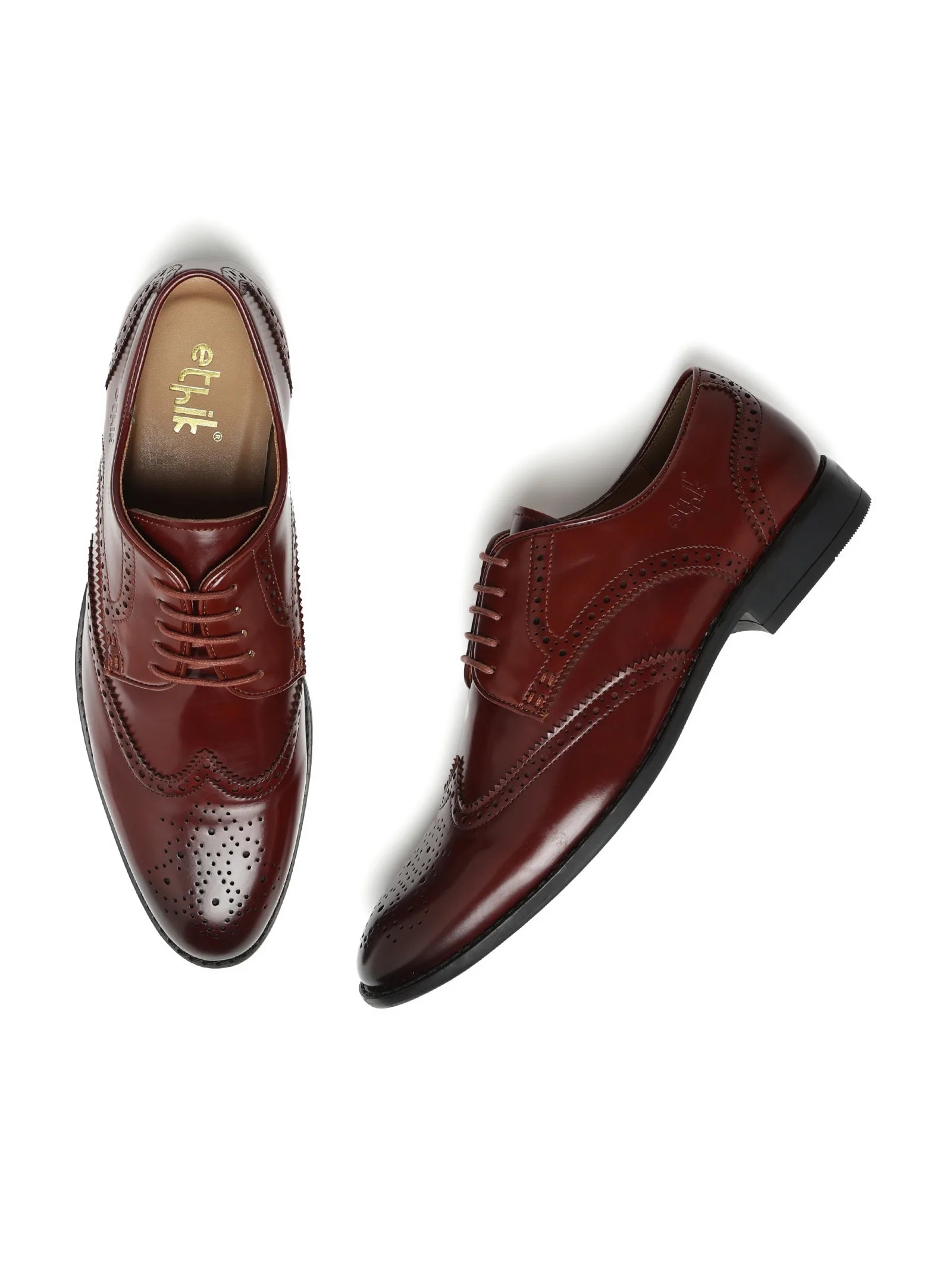 Pair of brown dress shoes on a white background