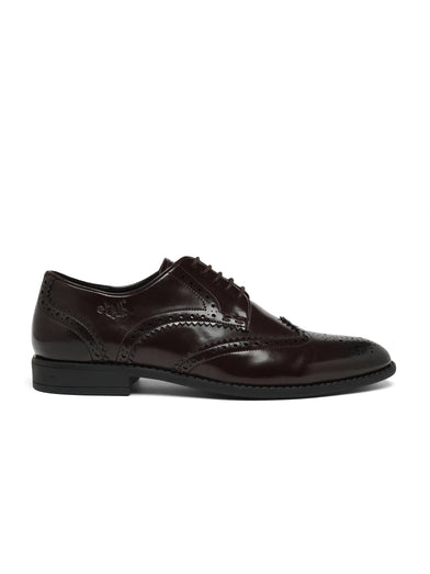 Black leather brogue shoe on a white background