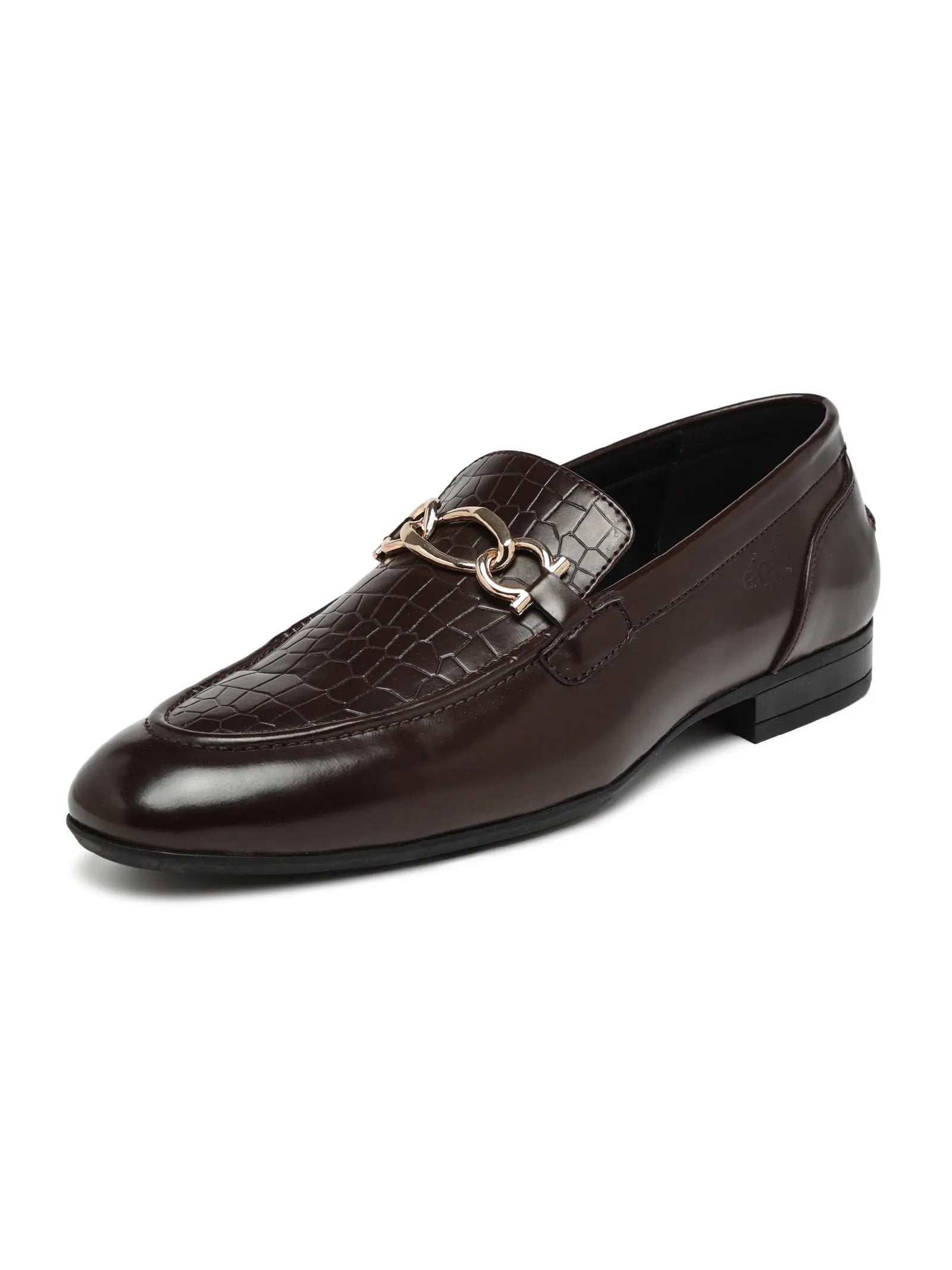 Brown leather loafer with a decorative buckle on a white background