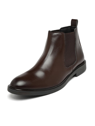 Brown leather Chelsea boot on a white background