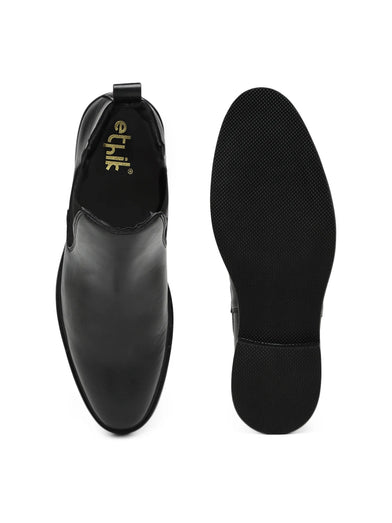 Black leather shoes with 'ethik' branding on a white background